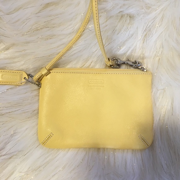 Coach Handbags - Small yellow coach wristlet 😍